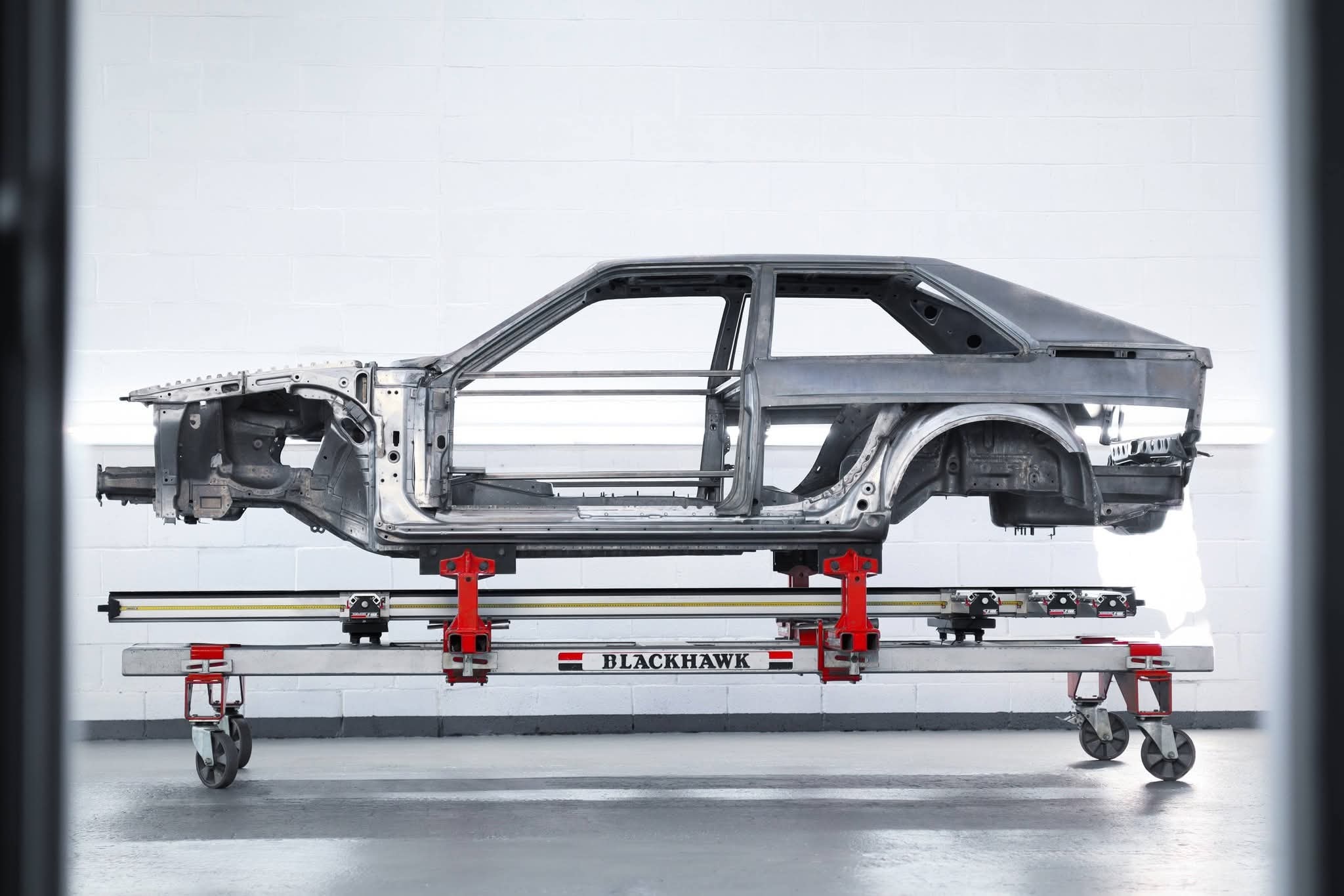 Space Saver Auto Lifts real installation — car frame on lift platform